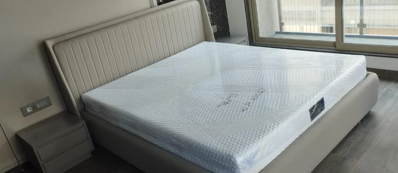 Custom bed frame built by Woodflex Designs, photographed in our Surat workshop