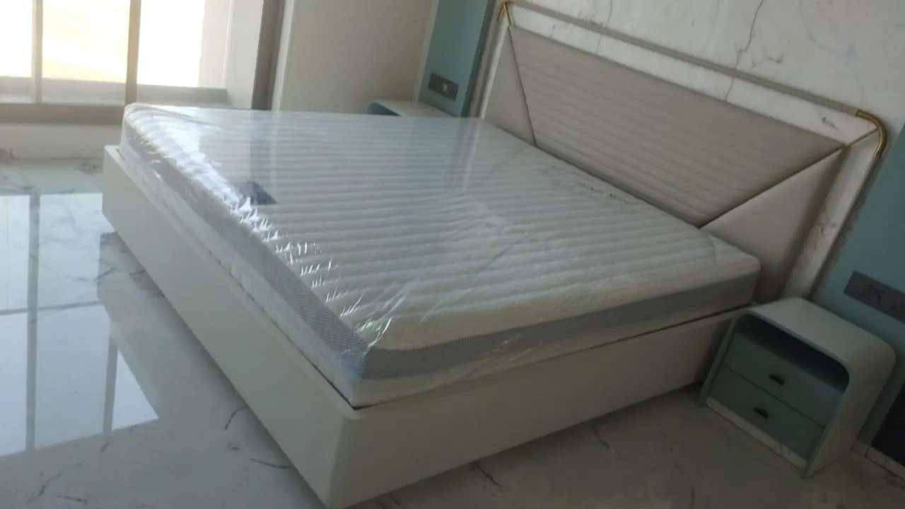 Custom bed frame built by Woodflex Designs, photographed in our Surat workshop